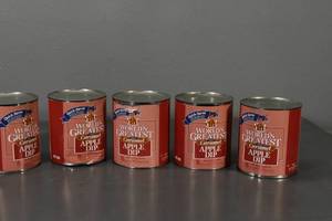 lot 129 image: 5) Gal Soft Carmel Apple Dip, cans have dents