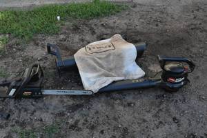 lot 10 image: Chain saw and blower vac