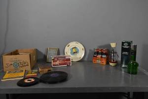 lot 108 image: Old items, Coke bottles, Cologne, books