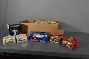 lot 235 image: 7 Model trucks & VHS tapes