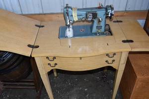 lot 150 image: Sewing machine & cabinet