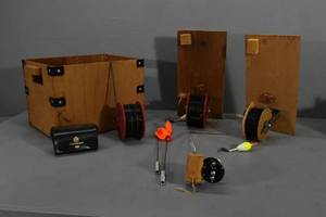 lot 21 image: Homemade Rattle reels in wood box