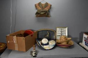 lot 27 image: Sombreros,pictures, clothespin bag