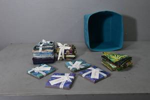 lot 66 image: 4 Charm squares & fat qtrs