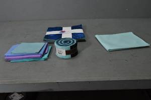 lot 104 image: Batiks Jelly roll & Layer cakes