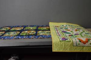 lot 147 image: Catepiller & Football Quilts
