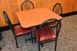 lot 57 image: Table with four red seat chairs