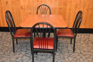 lot 56 image: Table with four red seat chairs
