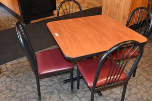 lot 63 image: Table with four red seat chairs