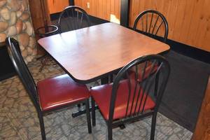 lot 62 image: Table with four red seat chairs