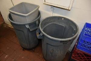 lot 438 image: 2 Rubbermaid Grabage Cans on Rollers
