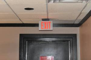 lot 73 image: EXIT sign above West door
