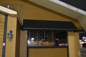 lot 87 image: Three Canopy, two large over windows, one small over doors