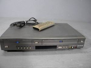 lot 29 image: DVDVHS player with remote