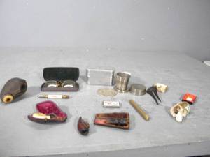 lot 78 image: Pipe parts, metal cup, lumber pencil