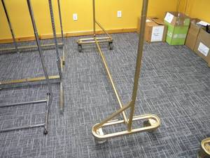 lot 24 image: 4 Wheel garment display rack 6 long x 75 tall