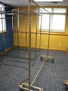 lot 23 image: 4 Wheel garment display rack 6 long x 75 tall