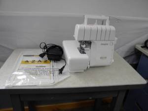 lot 110 image: Imagine Baby Lock 4 spool Serger waccessories