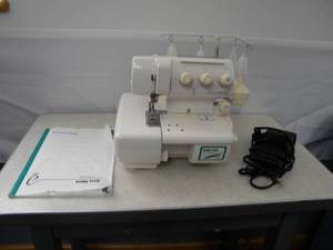 lot 130 image: Baby Lock Coverstich 4 spool VLCS wmanuel