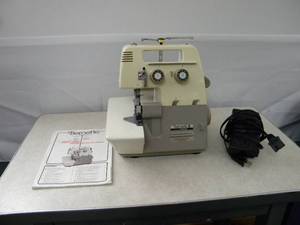 lot 140 image: Bernette Serger Model 2.03 3 spool wmanual