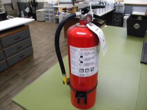 lot 217 image: Charged Fire Extingusher and wall bracket
