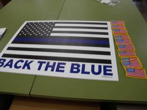 lot 244 image: US Flag that flew over the capital and vest patches