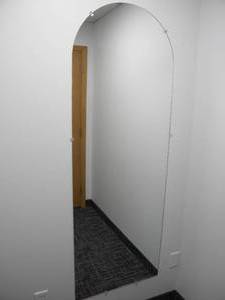 lot 56 image: Wall mirror 24 wide x 68 tall wround top