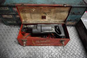 lot 75 image: Older Milwaukee sawsall wmetal case