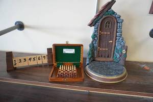 lot 5 image: Mini Chess set, shut the box game, faerie Door, box of playing cards, scrabble