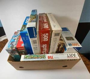 lot 99 image: Box of 9 Puzzles