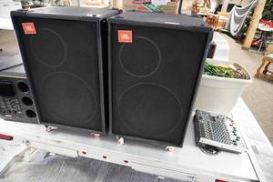 lot 36 image: 2 JBL speakers on casters whandles