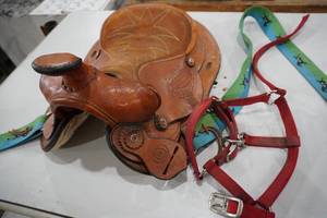 lot 19 image: 12 Leather saddle & halter