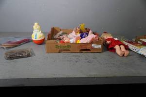 lot 110 image: Xylophone, doll, jump rope, doll parts
