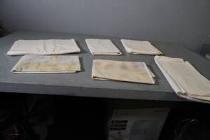 lot 3 image: Many pieces of neutral yardage