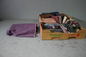 lot 34 image: Many flannel pieces of fabric