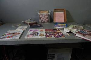 lot 57 image: Many quilting books & kits