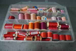 lot 104 image: Case of thread-RedOrangePick