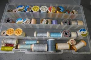 lot 107 image: Case of thread-Grey, Blue & White