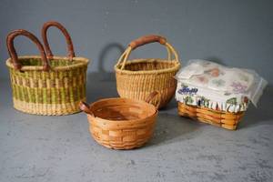 lot 129 image: Box of four small baskets