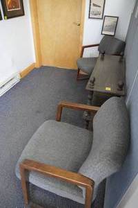 lot 323 image: Four padded receiption area arm chairs & shelf