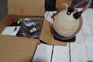 lot 207 image: Transmission fluid filler kit with adapters