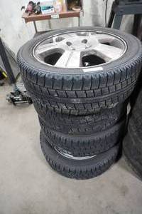 lot 341 image: 4) Nitto Studless tires on Ford rims 20550R16
