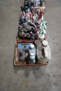 lot 7 image: Oil Filter crusher and flats of chemicals, oils and cleaners