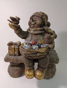 lot 21 image: Snowgirl on Bench with Lindt Lindor Truffles
