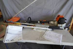 lot 124 image: Stihl KM 130 R with three attachments & extensions