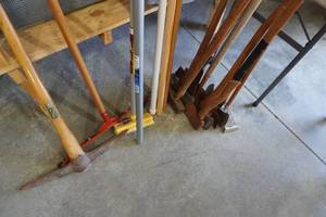 lot 133 image: Yard tools, axes, maul, squeegy, dowels & more