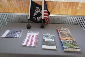 lot 17 image: Flags- 3 POW, American and Harley