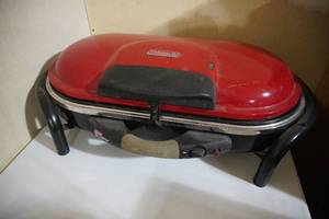 lot 12 image: Coleman Roadtrip propane grill & travel bag