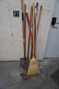 lot 99 image: Two shovels, two hoes, two brooms