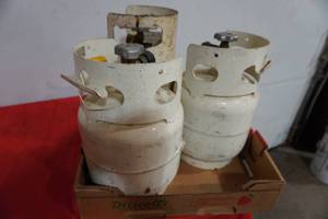 lot 169 image: Three small propane tank-seem to be full